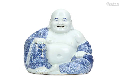 A CHINESE BLUE AND WHITE PORCELAIN BUDDHA Early 20th Century. Seated in flowing robes the belly