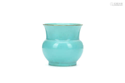 A CHINESE MINT GREEN GLAZED ZHADOU. Of circular form, the vessel carved with a tapered body rising