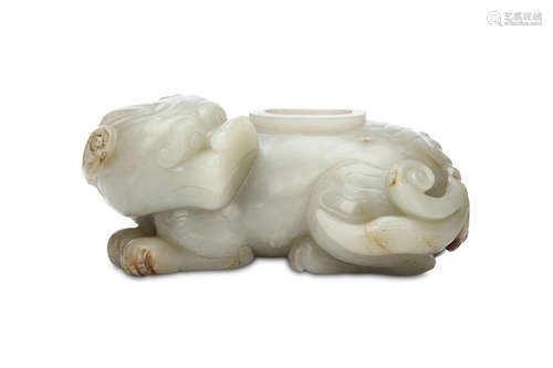 A CHINESE JADE LION DOG WASHER. Seated with the legs tucked beneath the tail curled around the body,