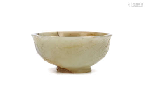 A CHINSE CARVED JADE ‘MUSK-MALLOW’ CUP. Ming Dynasty. The rounded body supported on a flared foot