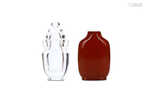 A CHINESE AMBER SNUFF BOTTLE TOGETHER WITH A ROCKY CRYSTAL SNUFF BOTTLE. Qing Dynasty. 7.5 / 8cm