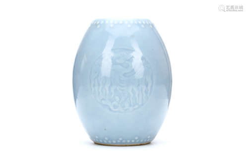 A CHINESE BLUE GLAZED JAR. Qing Dynasty. The ovoid sides moulded with two bands of bosses with two