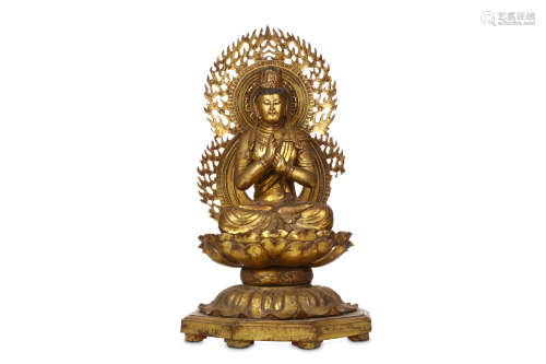 A CARVED WOOD FIGURE OF GUANYIN. 20th century or later. Carved from a single block, the deity seated