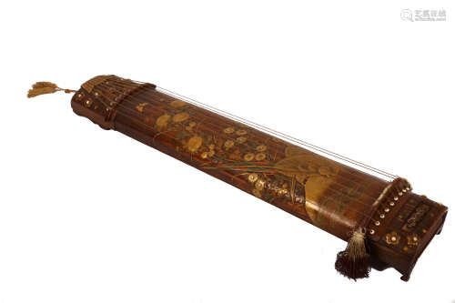 A SMALL POULONIA KOTO. Edo period. With nine strings, richly decorated in thick gold lacquer