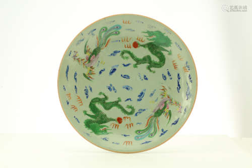A PAIR OF CHINESE CELADON GROUND ‘DRAGON AND PHOENIX’ DISHES.  Qing Dynasty, Daoguang mark and