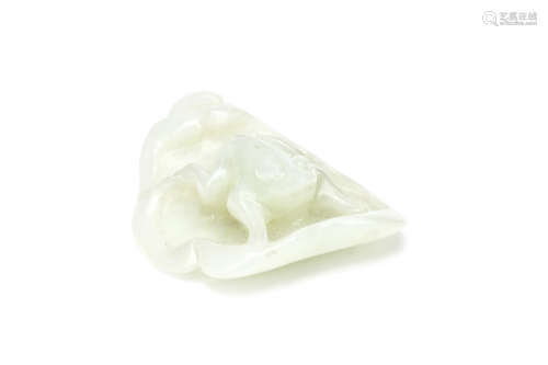 A CHIENSE JADE CARVING OF A FROG ON A LEAF. Qing Dynasty. The lotus leaf naturalistically carved