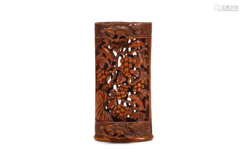 A CHINESE CARVED BAMBOO BIRD FEEDER. Qing Dynasty, 18th / 19th Century. One side deeply carved and