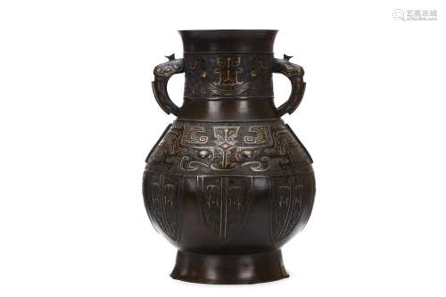 A GOLD AND SILVER INLAID BRONZE VASE. Qing Dynasty, 18th / 19th Century. Of pear-shaped form, with
