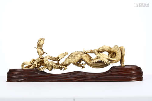 A FINE IVORY OKIMONO GROUP. Meiji period. Intricately carve with Son goku (Monkey King) standing