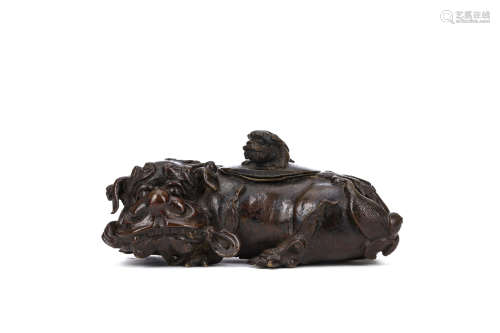 A CHINESE ‘BUDDHIST LION DOG AND PUP’ BRONZE CENSER AND COVER. 17th Century. Modelled as a recumbent