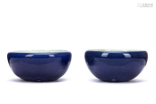 A PAIR OF CHINESE MONOCHROME BLUE GLAZED JARDINIÈRE. Qing Dynasty. Of compressed circular form,
