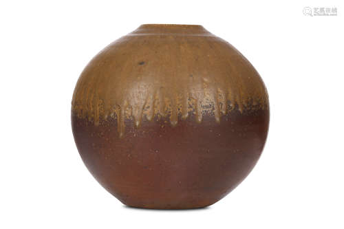 A BIZEN WARE FLOWER VASE. Showa period. Of a full moon shape, brown gritty body with running down