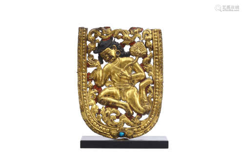 A GILT COPPER REPOUSSÉ PLAQUE DEPICTING A MAN IN TIBETAN DRESS. Tibet, 18th Century. Depicting a