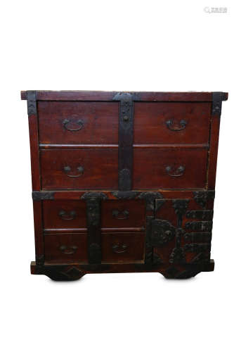 A KURUMA TANSU. 19th Century. A wood merchant chest with wheels, set with differently sized drawers,