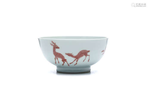 A CHIENSE COPPER RED ‘DEER AND PEACHES’ BOWL. Qing Dynasty, Yongzheng era. 6.5cm H, 13cm diameter