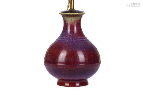 A CHINESE FLAMBÉ GLAZED BOTTLE VASE. Qing Dynasty, incised Yongzheng mark and of the period.