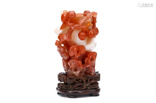 A CHINESE CARNELIAN AGATE ‘LINGZHI’ VASE. 19th / 20th Century. Carved as a gnarled trunk with
