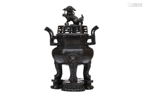 A CHINESE BRONZE TRIPOD CENSER AND COVER. Ming Dynasty. The censer is heavily casted with a