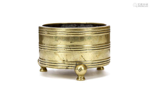 A CHINESE TRIPOD BRONZE CENSER. Ming Dynasty. Of archaistic lian form, the cylindrical body