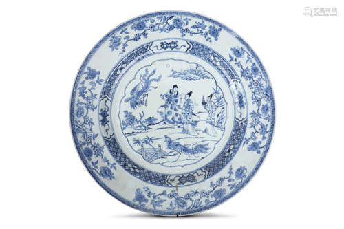 A CHINESE BLUE AND WHITE DISH. Qing Dynasty, Qianlong era. The central roundel with a two ladies and