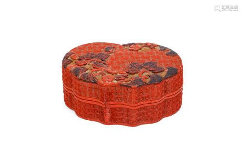A CHINESE THREE-COLOUR CINNABAR LACQUER 'LYCHEE' BOX AND COVER. Qing Dynasty, 18th Century. Of