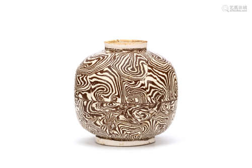 A CHINESE MARBLED POTTERY JAR. Tang Dynasty. Of globular form standing on a flat foot, with lipped