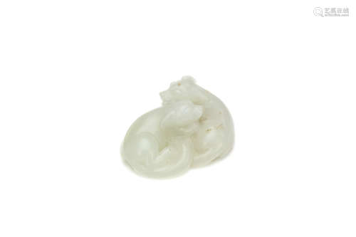A CHINESE WHITE JADE 'DOGS' CARVING. Qing Dynasty. The two animals seated with the legs and tails