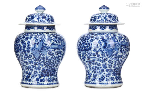 A PAIR OF CHINESE BLUE AND WHITE VASES WITH COVERS. Qing Dynasty. Of baluster form with domed