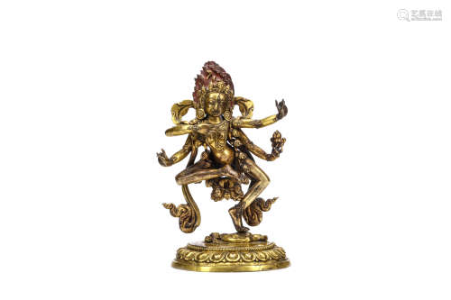 A GILT BRONZE FIGURE OF KURUKULLA. Qing Dynasty, Qianlong era. Depicted standing on one leg atop a