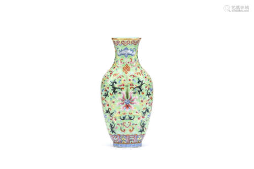 A CHINESE LIME GREEN GROUND FAMILLE ROSE VASE. Qing Dynasty, Qianlong mark and of the period. The
