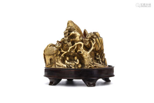 A CHINESE IVORY ‘LANDSCAPE’ CARVING. 19th / early 20th Century. Carved around an open centre with