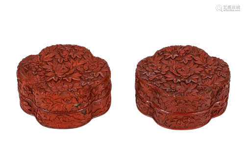 A PAIR OF CHINESE CINNABAR LACQUER BOXES AND COVERS. Qing Dynasty. Of quatrefoil form carved over