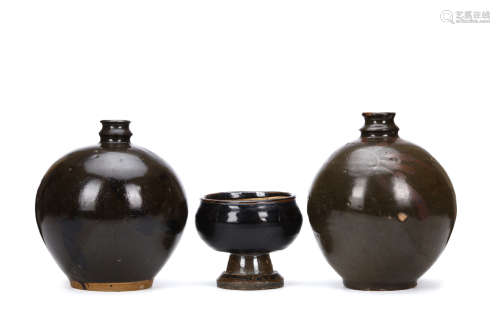 TWO CHINESE BLACK GLAZED JARS AND A STEM BOWL. The jars of globular form with a narrow waisted neck,