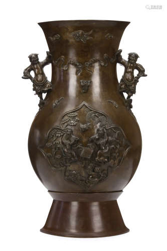 A MASSIVE CHINESE BRONZE VASE. Early Qing Dynasty. Of archaistic hu form, with a flattened pear-