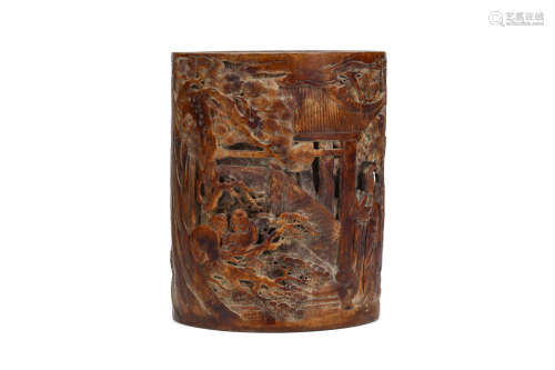 A CHINESE BAMBOO BRUSH POT. Qing Dynasty. Carved and pierced with figures in a garden setting