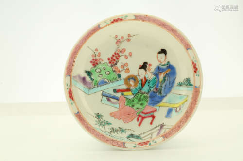 A CHINESE FAMILLE ROSE ‘LOVERS’ TEACUP AND SAUCER. Qing Dynasty, Yongzheng era. Brightly enamelled