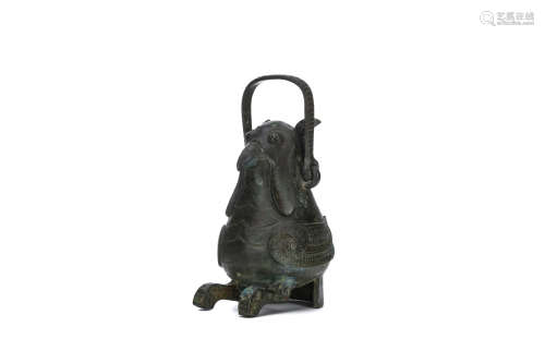 A CHINESE BRONZE OWL WINE VESSEL, ZUN. Ming Dynasty. Seated resting of curved tail feathers the feet