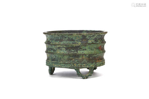 A CHINESE BRONZE CENSER. Qing Dynasty. The body formed as a nodular bamboo trunk, with a ring of