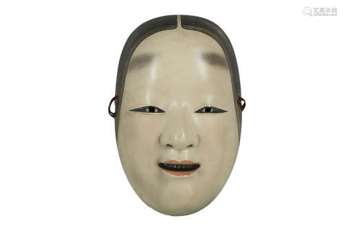 A NHO MASK OF KO-OMOTE. 19th / 20th Century. A female mask with a serene expression, painted in