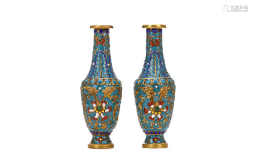 A PAIR OF CHINESE CHAMPLEVÉ ENAMEL VASES. Qing Dynasty. The bodies of each decorated with lotus