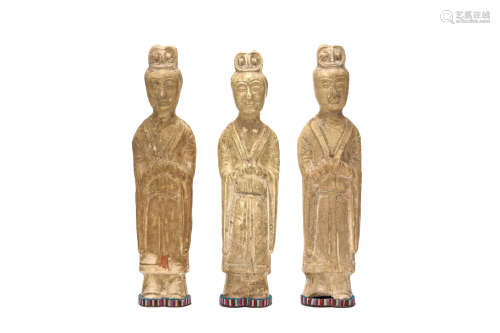 THREE CHINESE GLAZED MODELS OF OFFICIALS. Sui Dynasty. Each standing with hands together below