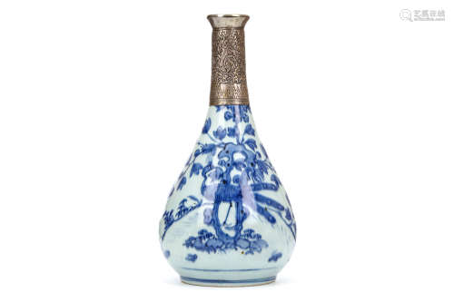 A CHINESE BLUE AND WHITE ‘PEACOCK’ BOTTLE VASE. Ming Dynasty. The pear-shaped body painted with the