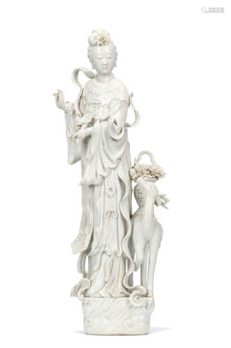 A CHINESE DEHUA STANDING FIGURE OF MAGU AND DEER. 20th Century. The figure is elegantly potted