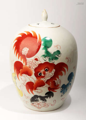 A IRON RED GLAZED PROCELAIN JAR AND COVER PAINTED WITH