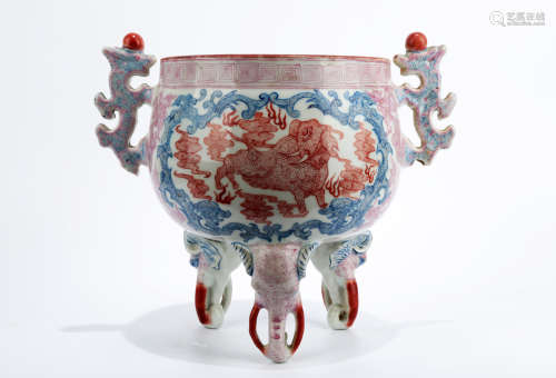 A DOUCAI TRIPOD CENSER WITH TWO EARHANDLES. THE BASE