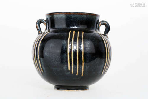A BLACK GLAZE PORCELAIN HANDLED EWER WITH TWO RINGS.C287.