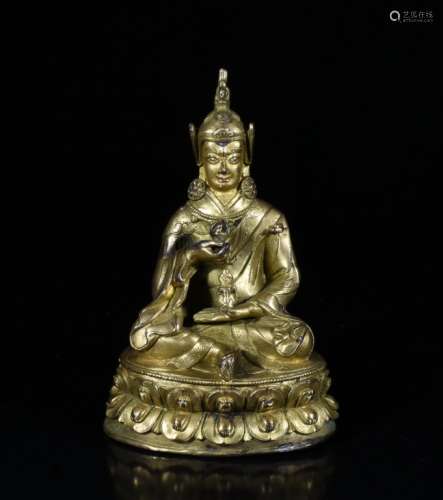 A GILT-BRONZE FIGURE OF BUDDHA