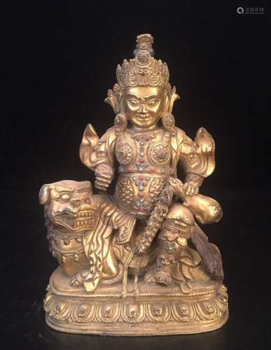 A GILT-BRONZE FIGURE