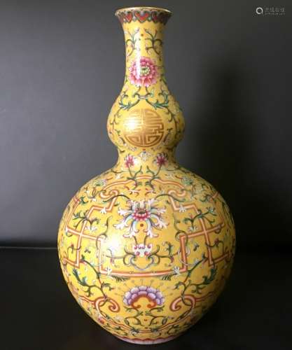 A YELLOW-GROUND FAMILLE ROSE DOUBLE GOURD VASE