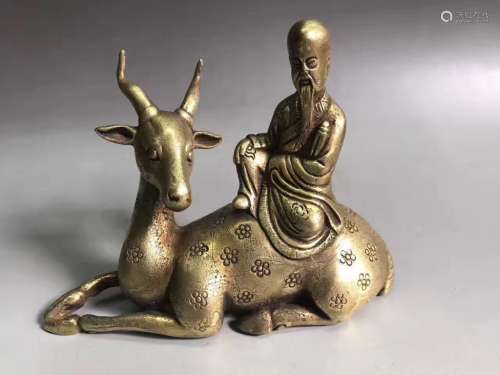 A GILT-BRONZE FIGURE OF DAMO AND DEER